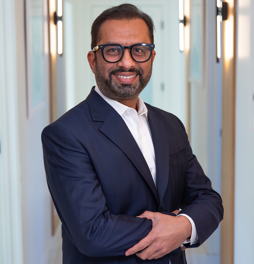 Dr. Baseer Ahmed in business suit